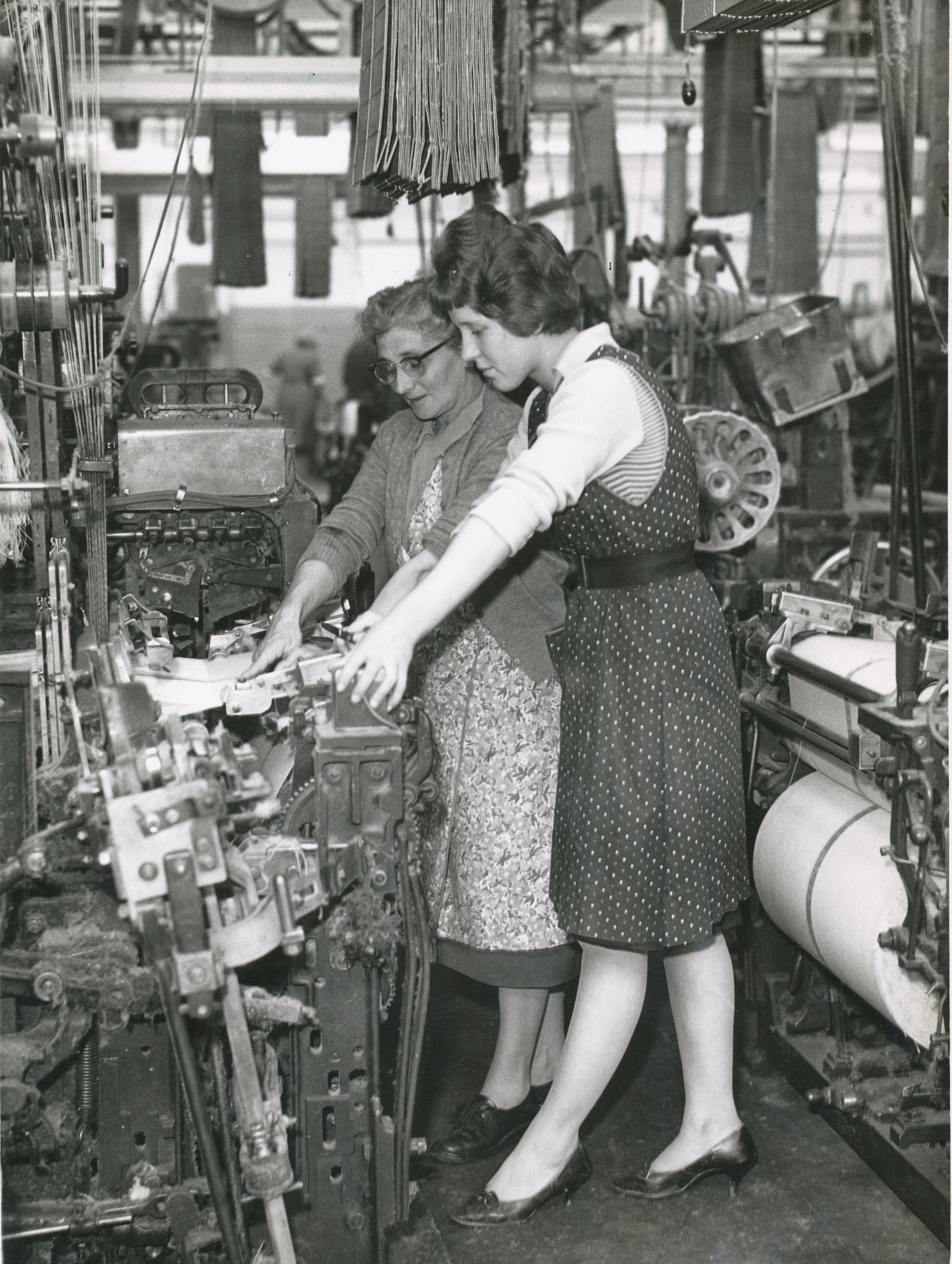 Two women weavers at loom image