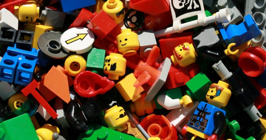 image depicting pieces of lego, including figures, bricks and other miscellaneous pices