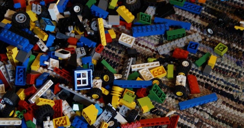 image showing pieces of lego on a rug image showing pieces of lego on a rug