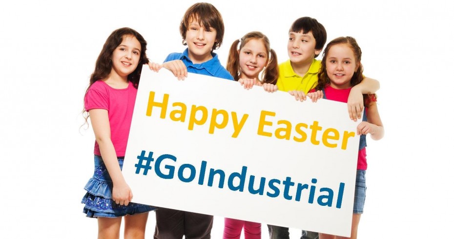 group of children holding up a sign that says happy easter go industrial