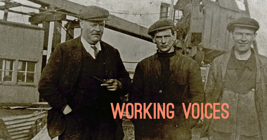 photograph of three men with industrial site in background