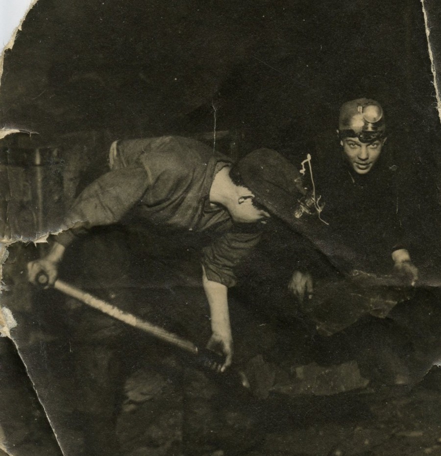 black and white photograph of 2 miners in shale pit