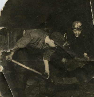  2 young miners loading shale underground in Westwood pit image