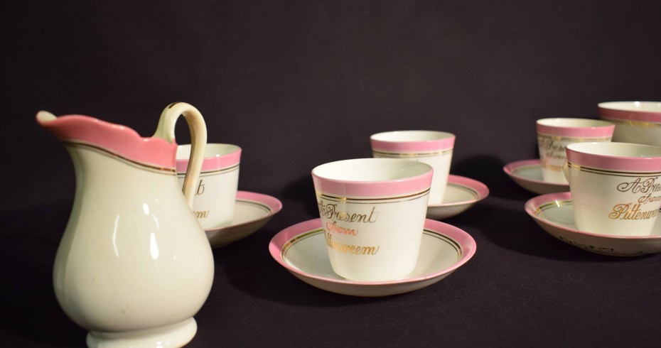 image of a jug with cups on saucers