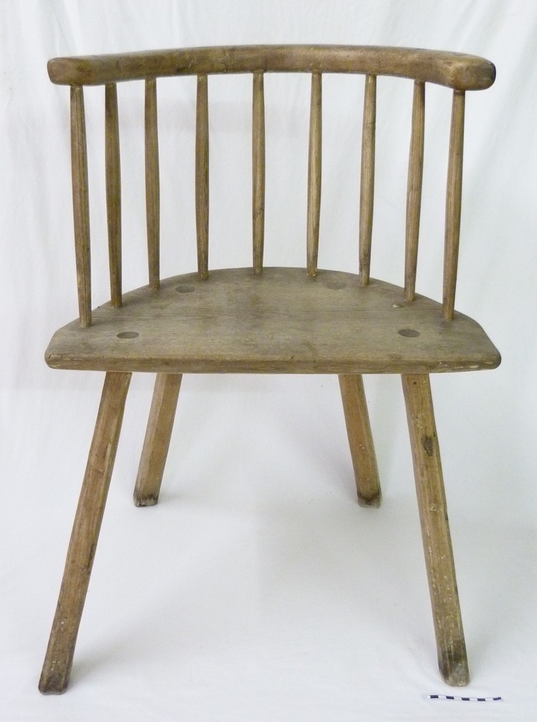 Wooden chair with a half-round seat and a simple stick back