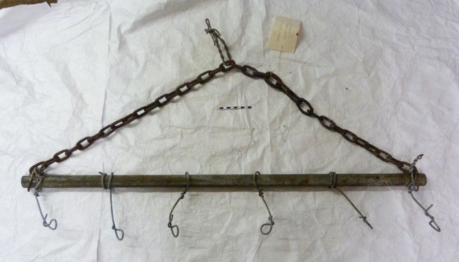 Home made harrow pole, formed by steel tubing with attached fencing wire and iron chain