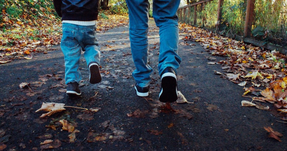 family walk woods child parent feet leaves