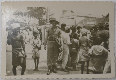 Photograph of a solider in a crowd, location unknown image